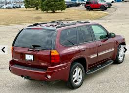 Image result for Medium Red 2002 Envoy