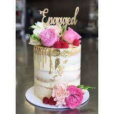 Then, put a thick layer of frosting on your cake as a base, making it as smooth as possible. Engagement Cake Topper By Cookie Cake Design Celebration Cakes Drip Cakes Occasion Cakes