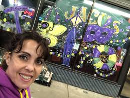 Local author, artist creates Mardi Gras parade through window paintings