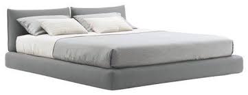 A platform bed with headboard and footboard prevents your mattress from slipping. Sources For A Low Profile Upholstered Bed Upholstered Bed Frame Low Bed Frame Modern Bed