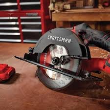 There is a small metal button between the saw/motor housing and the blade guard. How To Use A Circular Saw