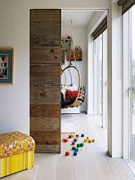Pocket Door With Wide Plank Barnwood Look Contrasts Nicely With The Clean Modern Look Of The Floor Doors Interior Wood Doors Interior House And Home Magazine