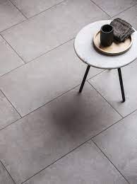 I would choose the lighter gray grout. District Light Grey Porcelain Tile Mandarin Stone