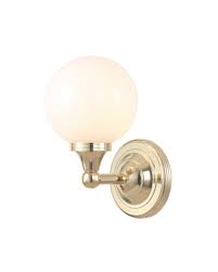 The perfect finishing touch above a sink or vanity. Elstead Lighting Austen4 Solid Brass 1 Light Bathroom Wall Light In Polished Brass With Opal Glass Globe Ip44