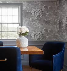 Royal Blue Velvet Dining Chairs Surround A Burl Wood Dining Table Placed In Front Of A Wa Velvet Dining Chairs Blue Velvet Dining Chairs Glamourous Dining Room