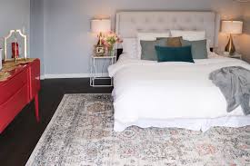 The bed is with the legs so that vacuuming and cleaning are easier under a flat weave area rug. How To Choose The Right Area Rug For Under Your Bed