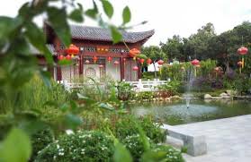 Flags china, malaysia countries, partnership friendship handshake concept. Ø¨Ø§Øº Ø¯ÙˆØ³ØªÛŒ Ú†ÛŒÙ† Ùˆ Ù…Ø§Ù„Ø²ÛŒ China Malaysia Friendship Garden