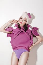 Seductive woman like sweet doll with candy. Candy Doll Not Just A Label