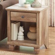 The solid hourglass shape of this end table is small enough to fit into cramped corners and will bring a pop of modern flair. 15 Best Rustic End Tables In 2018 Modern Country Wood End Tables