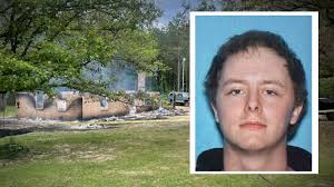 Escaped detainee killed in house fire during standoff, sheriff confirms