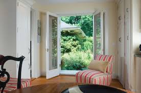 Beige and blue transitional living room features an oslo chandelier illuminating a. Wrestling With Style Maine Home Design