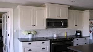 Tile backsplash ideas for black granite countertops there are limitless ways to get creative with black granite and other remodeling materials. Kitchen Backsplash With Black Granite Countertops And White Cabinets Youtube
