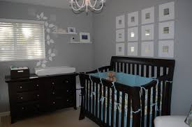 For a boy's nursery with a modern feel, use a bright blue wallpaper studded with white and orange polka dots. Grey Baby Nursery Here Is A Pretty Nursery With Grey Walls And Expresso Furniture Baby Bedroom Boy Room Baby Girl Room