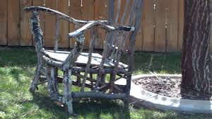 You may speak to trees and they are able to speak to table and chairs made out of tree stumps. A Big Chair That Is Made With Tree Branches Youtube