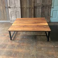 A coffee table is a low table designed to be placed in a sitting area for convenient support of beverages, remote controls, magazines, books (especially large, illustrated coffee table books), decorative objects, and other small items. Square Reclaimed Wood Coffee Table H Shaped Metal Legs What We Make