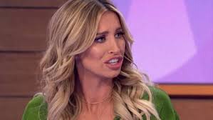 Ferne McCann teases her sensational abs in a white crop top and mini skirt 