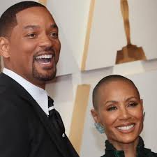Will Smith gently kisses Jada Pinkett-Smith's head