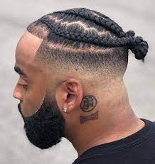 Short Braids Hairstyles Man With Black Hair Braided In A Bun Black Beard Black T Shirt Neck Tattoo Top Knot Hairstyles Hair Styles Mens Hairstyles