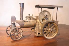 Le modèle est chauffé par du combustible sec. Tracteur A Vapeur Vive Pecard Jouets Anciens