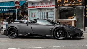 Pagani Huayra Bc Painted In Matte Black W Blue Light Covers Exposed Carbon Fiber And Blue And White Central Stripes Ph Pagani Huayra Pagani Pagani Huayra Bc