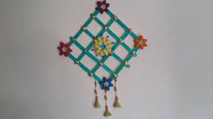 2 purple and yellow ice cream cone hanging decorations. Diy Wall Decor With Pista Shell Ice Cream Sticks Wall Hanging Kids Ro Ice Cream Stick Craft Stick Crafts Popsicle Stick Crafts House