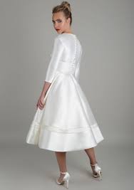 Check out our 3/4 sleeve wedding dresses from the latest bridal collection. Tea Length Wedding Dress With Sleeves And Deep V Bodice