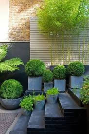 This Gorgeous Modern Green Garden Looks So Welcoming For Summer S Day I Love Lots Of Pots And Planters Small Garden Design Garden Inspiration Garden Design