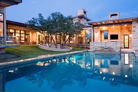The square, labeled pool, is smaller than the rectangle. Family Home With Outdoor Living Room And Pool