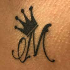 Some women are known to add the word princess to the crown tattoo along with flowers, jewels and hearts to add an extra dimension to their tattoo. Lettering Styles For Tattoo Luxury Cursive M Tattoos Tattoo Lettering Tattoo Lettering Styles Initial Tattoo