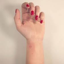 Red Ink Heart Tattoo On The Wrist Red Heart Tattoos Heart Tattoo Wrist Small Heart Wrist Tattoo