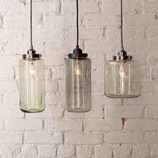 Lighting Glass Jar Pendants From West Elm Remodelista Jar Pendant Light Glass Pendant Light Glass Pendent Lights