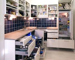 Bearded repairman holding adjustable wrench and looking under broken sink in kitchen. Upper Cabinets Vs Open Shelving In The Kitchen Fairmont Flooring