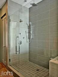 They're also easy to maintain, without any grout lines. Rectangle Tile Shower Stall Designs Shower Heads And A Separate Handheld Sprayer Give The Sho Bathroom Interior Design Bathroom Floor Plans Bathroom Interior