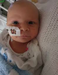 Fussy' baby goes floppy in mum's arms and nearly dies from 'missed'  condition