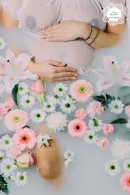 Milk bath maternity photos involve a pregnant woman posing in a tub of milk. Maternity Milk Bath By Niki Photography