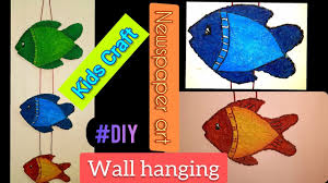 Made of wood and metal, this handcrafted array of fish in soft gray, white, and blue hues adds a soothing splash of color and dimensional beauty to any wall. Fish Wall Hanging 5 Minutes Craft Kids Craft Newspaper Craft Best Out Of Waste Youtube