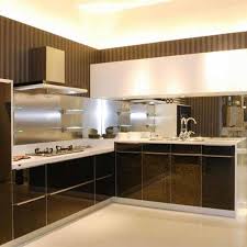 Next, immediately paint the remaining flat areas of the door using a mini roller. China Classic Black White High Gloss Paint Kitchen Cabinets China Kitchen Cabinets Kitchen Furniture