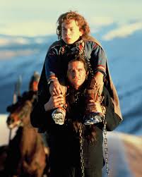 A young val kilmer stands in front of a microphone. A Young Val Kilmer And Warwick Davis In Willow The Movie 1988 Nostalgia