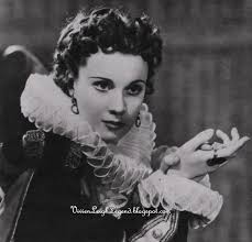 Rhett Butler struts and scoffs in the person of Clark Gable, unanimous  choice of all fans for this assignment. Scarlett O'Hara, fiery,  temperamental and courageous, is the lovable hellcat of the book,