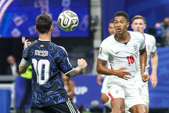Jude Bellingham player of England and Lionel Messi player of Argentina  during the FIFA World Cup semifinal match between England and Argentina, at  Atlanta Stadium, in Georgia, United States, on Wednesday, July