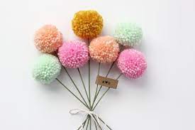 These pom pom flowers are a fun addition to your spring and summer decor. Mini Yarn Pom Pom Flowers Bouquet 7 Poms By Stephlovesben On Etsy Pom Pom Flowers Flower Bouquet Diy Yarn Pom Pom