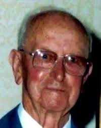 Circa 1930- George Queen Making a Basket. The little box house contrived of  odd lengths of lumber where Preacher Queen would weave his baskets  overlooked the Plumtree road from the bank side