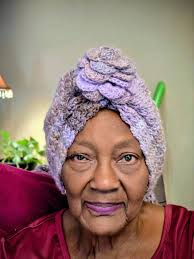 Made a cacoon sweater and matching hat for my MIL.The curly hair is  removable.