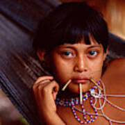 Yanomami Girl Relaxes In A Hammock by Robert Caputo