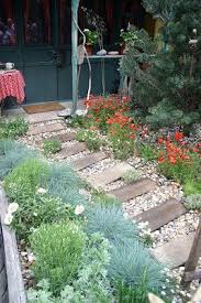Pretty For A Prayer Garden Planks Of Wood Every So Often Pretty Pebble Garden Beach Theme Garden Garden Inspiration