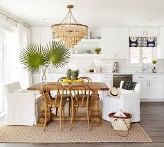 Introduce a touch of contemporary style to your home with this award winning trestle table with rectangular glass top. Beige Beaded Chandelier Over Small Reclaimed Wood Dining Table Cottage Dining Room