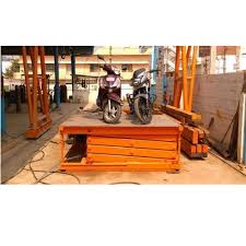 Homemade motorcycle lift constructed from 3/4 plywood, gi pipe, and wooden planks. Hydro Fabs Hydraulic Bike Lift For Industrial Rs 350000 Onwards Hydro Fabs Id 13047232133