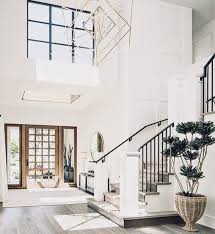 Light Fixture Lighting In The Entryway Of A Light And Bright Home House Design House Open Entryway