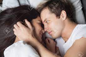 Done with like loving caresses? Happy Loving Couple Relaxing On Bed At Home Young Man Touching Stock Photo Picture And Royalty Free Image Image 95120095