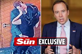 Mr hancock was pictured embracing his aide. 9mn85zncmvapqm